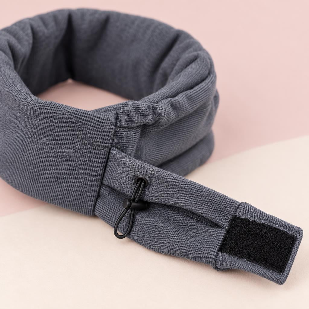 Close-up of the grey fleece dog ear snood on a soft pink background